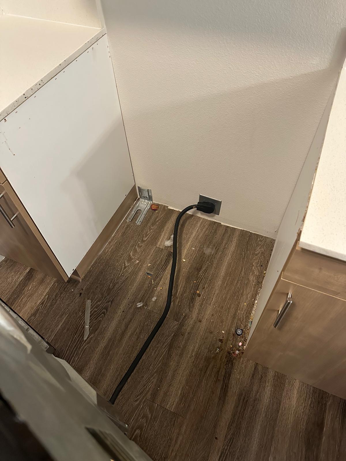 Before: Behind the appliances — debris — Keep Clean Solutions LLC