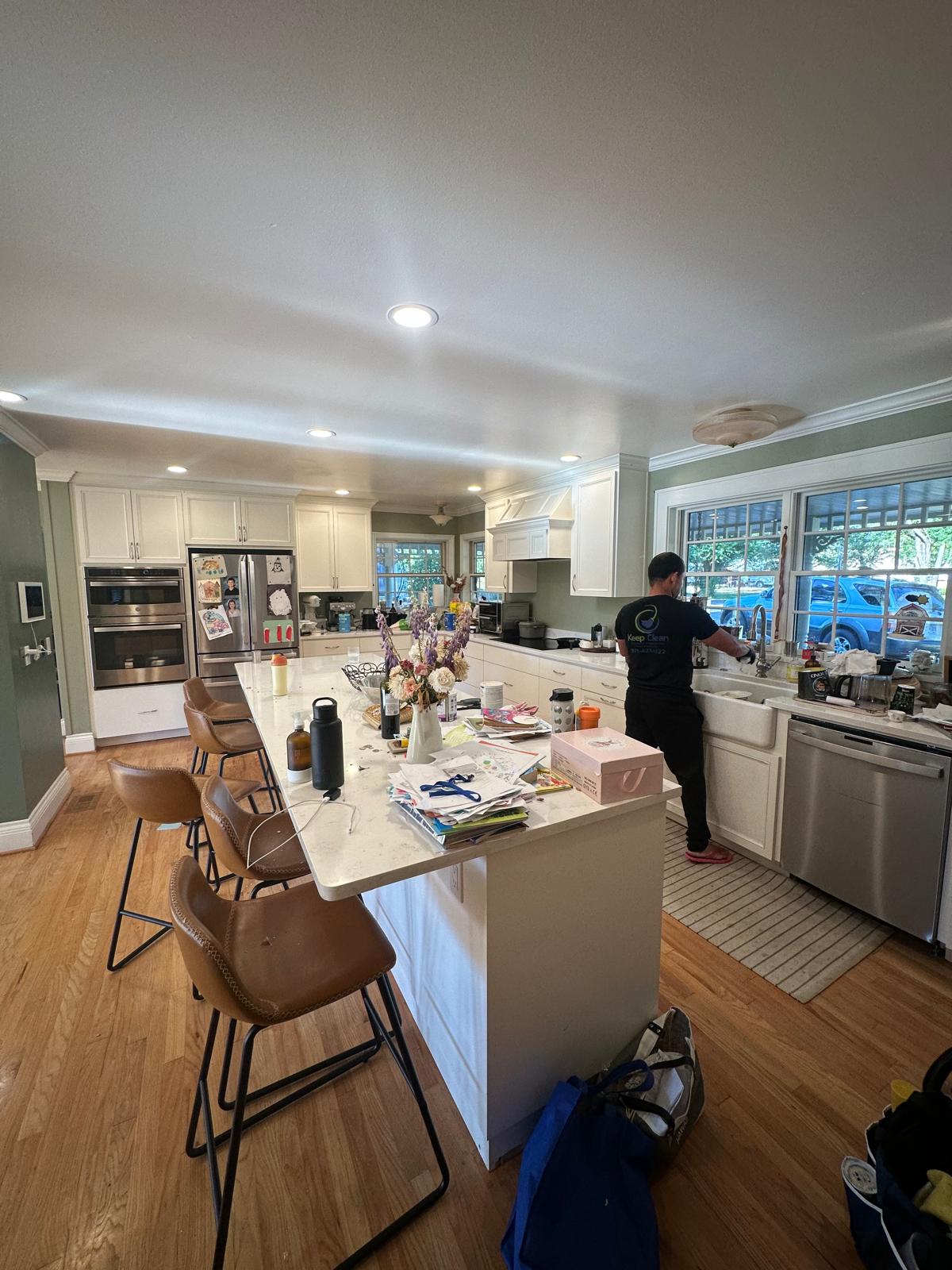 Before: Kitchen island — cluttered countertops — Keep Clean Solutions LLC