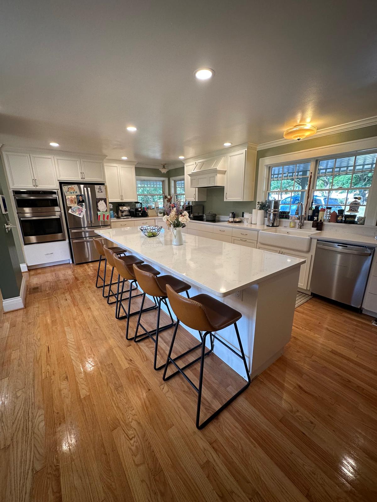 Clean kitchen island with polished countertops after house cleaning in Portland Oregon