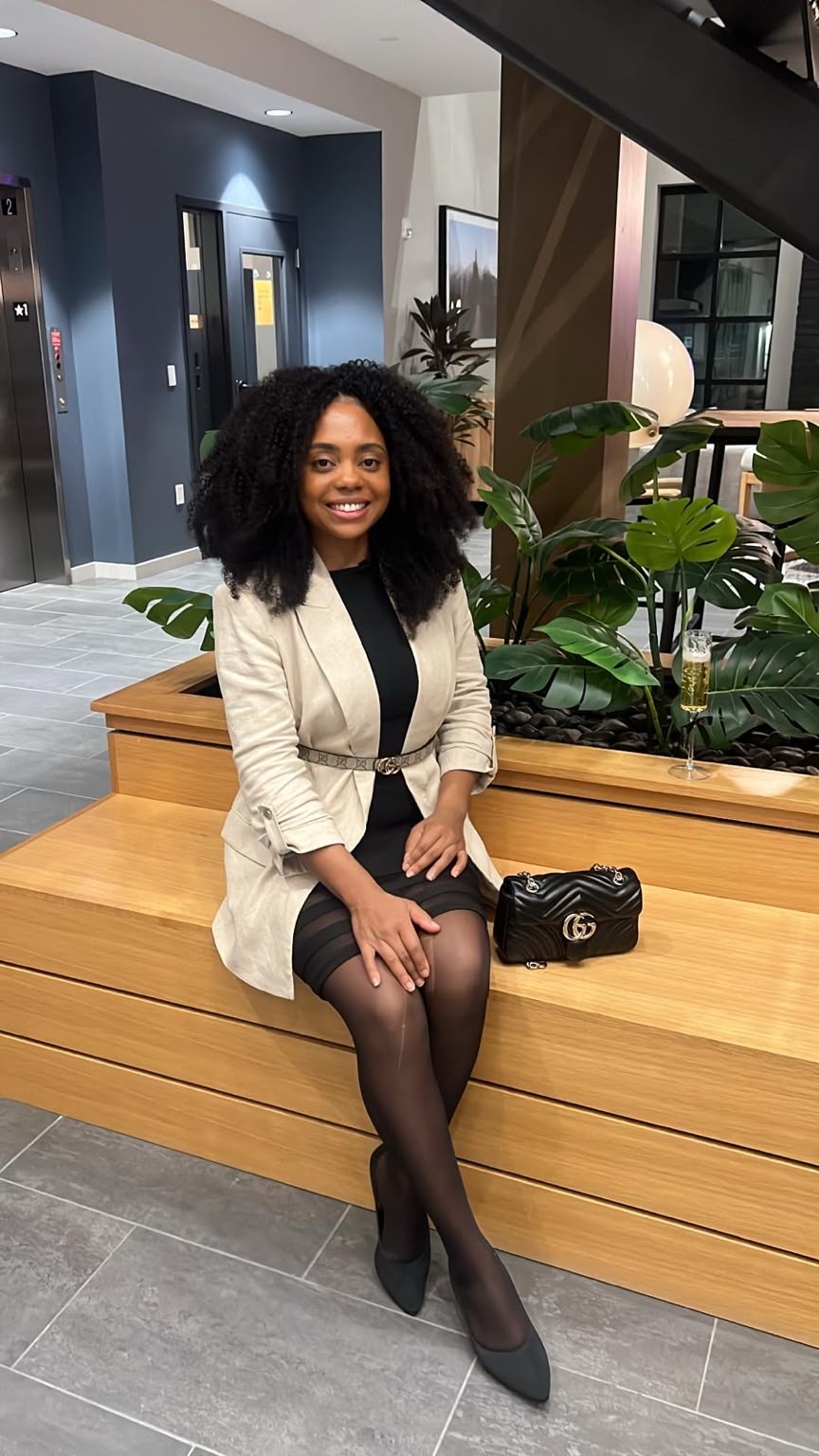 Eline, founder of Keep Clean Solutions LLC, in a modern lobby